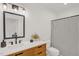 Modern bathroom features new fixtures, a sleek vanity, and shower curtain at 908 Woodland Grove Way, Wake Forest, NC 27587