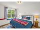 Comfortable bedroom with a large window, cozy bed, and natural light at 908 Woodland Grove Way, Wake Forest, NC 27587