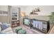 Cozy bedroom with two cribs, a sofa, and a window that provides natural light at 908 Woodland Grove Way, Wake Forest, NC 27587