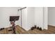 Well-lit home gym with exercise bike, weights, and wood-style flooring at 908 Woodland Grove Way, Wake Forest, NC 27587
