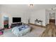 Spacious living room featuring a cozy beanbag, a TV, and lots of room for activities at 908 Woodland Grove Way, Wake Forest, NC 27587