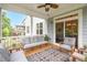 Screened porch with comfortable seating and ceiling fan offers relaxation and style at 908 Woodland Grove Way, Wake Forest, NC 27587