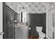 Stylish bathroom with a gray vanity, granite countertop, and a glass-enclosed shower at 909 Green Oaks Pkwy, Holly Springs, NC 27540