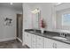 Bathroom features a double sink vanity, a large mirror and a glass door walk-in shower at 909 Green Oaks Pkwy, Holly Springs, NC 27540