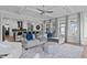 Open floor plan featuring a living room with hardwood floors and comfortable seating open to the kitchen at 909 Green Oaks Pkwy, Holly Springs, NC 27540
