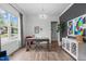 Modern office featuring a wood desk, stylish décor, and a large window offering natural light at 909 Green Oaks Pkwy, Holly Springs, NC 27540