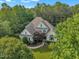 Captivating aerial view of a well-maintained house with lush landscaping and mature trees at 102 Bosswood Ct, Cary, NC 27518