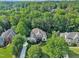 An aerial shot reveals a beautiful home with manicured landscaping and plenty of shade trees at 102 Bosswood Ct, Cary, NC 27518
