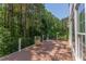 Large deck with railing, flower pot and private, wooded views perfect for enjoying the outdoors at 102 Bosswood Ct, Cary, NC 27518