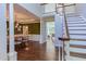 Spacious foyer with high ceilings and hardwood floors connects the dining room and living spaces at 102 Bosswood Ct, Cary, NC 27518