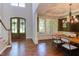 Spacious foyer with hardwood floors connects the dining room and staircase at 102 Bosswood Ct, Cary, NC 27518
