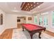 Bright game room with a red felt pool table, hardwood floors, recessed lighting and large glass doors at 102 Bosswood Ct, Cary, NC 27518