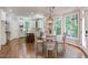 Gourmet kitchen with white cabinets, a large island, and a view of the outdoors at 102 Bosswood Ct, Cary, NC 27518