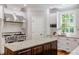 Well-equipped kitchen with a large island, stainless steel appliances, and white cabinets at 102 Bosswood Ct, Cary, NC 27518