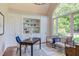 Bright office space with custom built-ins and a large arched window overlooking the garden at 102 Bosswood Ct, Cary, NC 27518