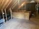 Unfinished attic with exposed rafters and plywood flooring is ready to be converted to living space at 104 Belle Isle Ct, Cary, NC 27513