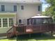Outdoor living on a spacious deck with gazebo and grill, perfect for entertaining at 104 Belle Isle Ct, Cary, NC 27513