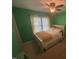 Inviting bedroom with decorative rug, lots of light and dark ceiling fan at 104 Belle Isle Ct, Cary, NC 27513