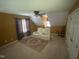 This room features a recliner, ceiling fan and lots of light from multiple windows at 104 Belle Isle Ct, Cary, NC 27513