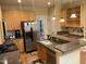 Well-equipped kitchen featuring stainless steel appliances, granite countertops and wood cabinets at 104 Belle Isle Ct, Cary, NC 27513