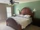 Spacious main bedroom with decorative rug, lots of light and dark wood furniture at 104 Belle Isle Ct, Cary, NC 27513