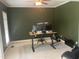 Office space with light carpet, green walls, crown molding, and a ceiling fan at 104 Belle Isle Ct, Cary, NC 27513