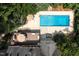 Aerial view of the backyard showcasing the pool, deck, and patio at 105 Woodsage Way, Cary, NC 27518