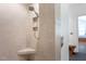 Tiled stand up shower with shower head, corner seat, and built in toiletry shelves at 105 Woodsage Way, Cary, NC 27518