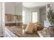 Bathroom featuring a granite countertop vanity, faucet, and neutral towel accents at 105 Woodsage Way, Cary, NC 27518
