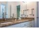 Bathroom featuring a granite countertop, double sink, and white cabinets at 105 Woodsage Way, Cary, NC 27518