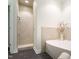 Bright bathroom features a stand up shower and modern bathtub with tiled surround at 105 Woodsage Way, Cary, NC 27518