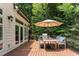 Outdoor deck space with grill, table and chairs for outdoor enjoyment at 105 Woodsage Way, Cary, NC 27518