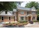 Beautiful brick home with lush landscaping and inviting curb appeal at 105 Woodsage Way, Cary, NC 27518