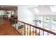 Bright entryway to living room features tall ceilings, many windows, and a ceiling fan at 105 Woodsage Way, Cary, NC 27518