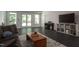 Inviting living room with tile floors, a piano, and natural light at 105 Woodsage Way, Cary, NC 27518