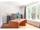 Bright home office boasts hardwood floors, a large window, and custom built-in storage at 105 Woodsage Way, Cary, NC 27518