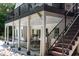 Covered outdoor patio and stairs leading to the upper deck at 105 Woodsage Way, Cary, NC 27518