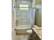 Stylish bathroom features marble tile, modern vanity and shower with tub at 106 Viola Ln, Franklinton, NC 27525