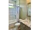 Stylish bathroom features marble tile, modern vanity and shower with tub at 106 Viola Ln, Franklinton, NC 27525
