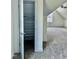 Bright bedroom featuring plush carpet, a ceiling fan, and a closet with built-in shelving for ample storage at 106 Viola Ln, Franklinton, NC 27525