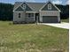 Charming one-story home featuring a two-car garage and a covered front porch at 106 Viola Ln, Franklinton, NC 27525