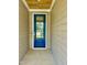 A stylish blue front door with glass inset, and stained wood porch ceiling at 106 Viola Ln, Franklinton, NC 27525