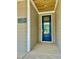 A stylish blue front door with glass inset, number plaque and stained wood porch ceiling at 106 Viola Ln, Franklinton, NC 27525