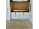 Garage featuring custom cabinets and a pegboard, creating an organized workspace for hobbies and storage at 106 Viola Ln, Franklinton, NC 27525