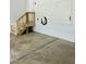 Clean garage featuring a wooden staircase and an electric car charging station, offering convenience and functionality at 106 Viola Ln, Franklinton, NC 27525