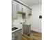 Laundry room features granite counters, lots of cabinets and built in drying racks at 106 Viola Ln, Franklinton, NC 27525