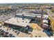High angle aerial view of a large commercial building surrounded by parking and autumn trees at 1108 Taylor Street, Durham, NC 27701
