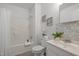 Cozy bathroom featuring a shower/tub combo, vanity with sink, and seashell decor at 1108 Taylor Street, Durham, NC 27701
