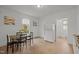 Kitchen and dining area with refrigerator, modern cabinets and a window for natural light at 1108 Taylor Street, Durham, NC 27701