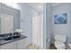 Bathroom featuring blue walls, tile floors, toilet, and marble sink at 111 Finsbury St, Durham, NC 27703